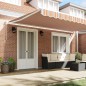 vidaXL Tenda da sole manuale retraibile a strisce multicolore 500 x 300 cm